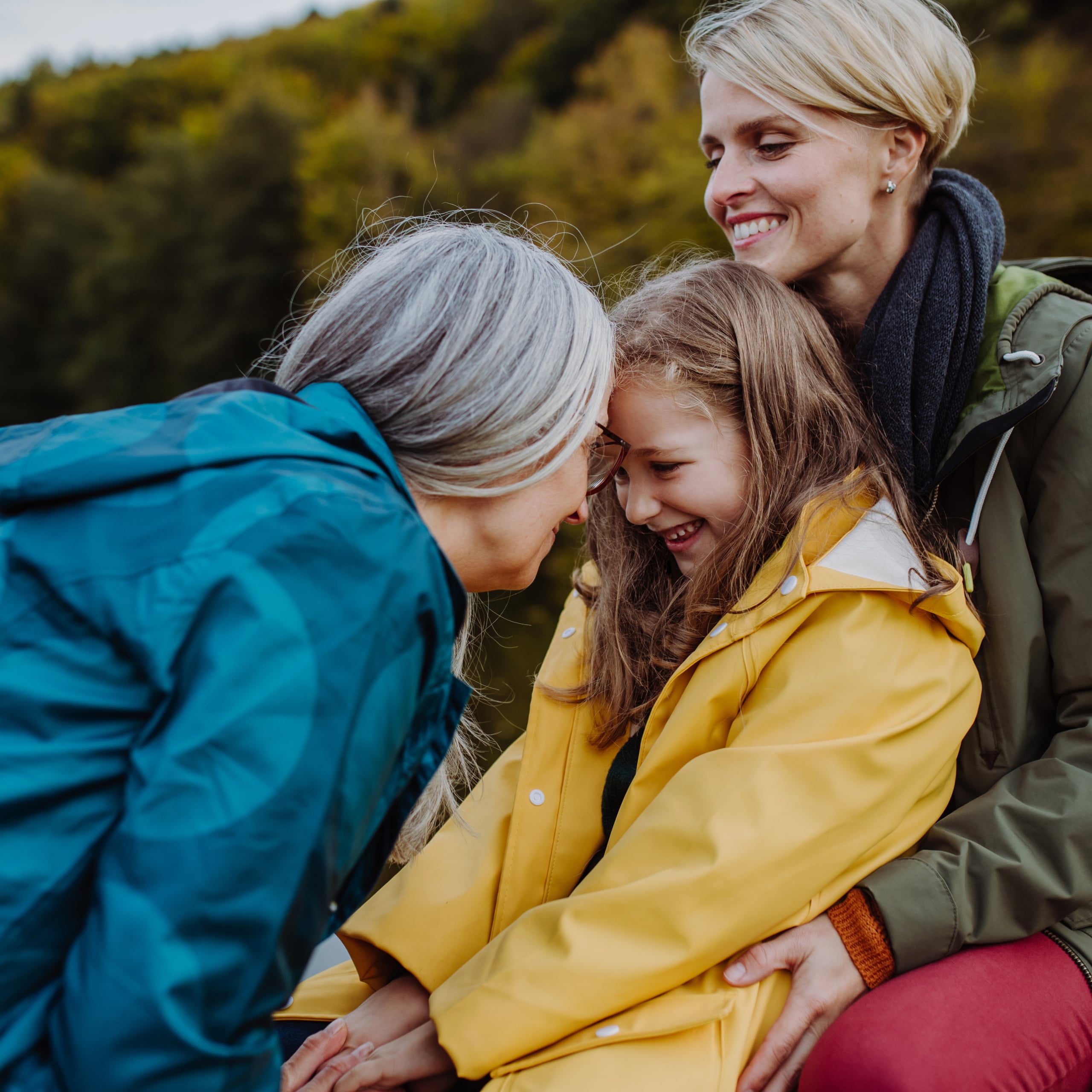A multigenerational family of women enjoys time outdoors.